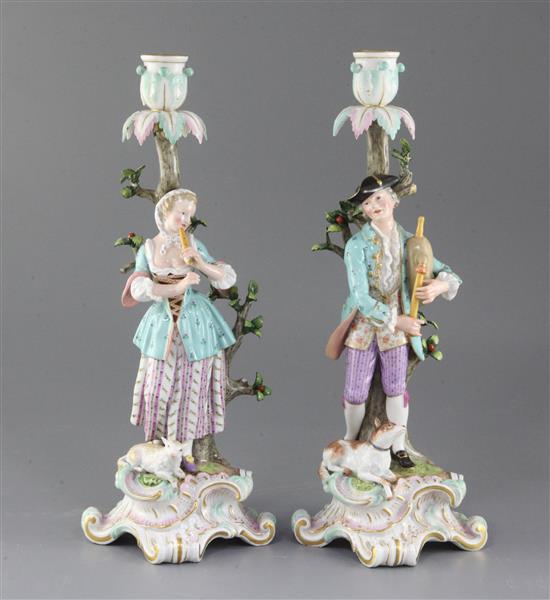 A pair of Meissen candlestick figures, late 19th century, height 36cm